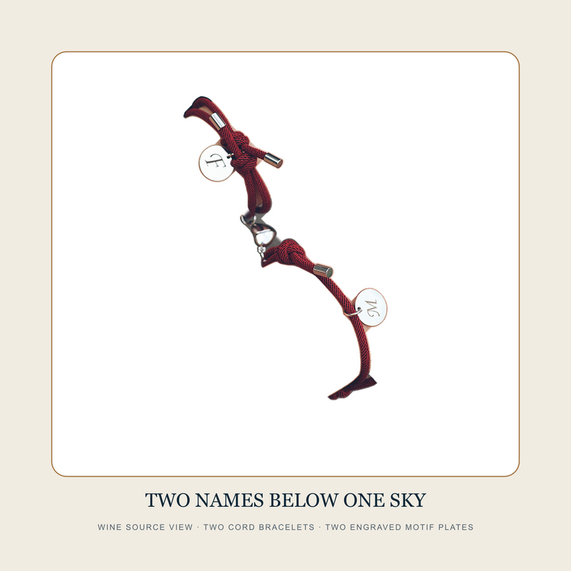 Wine source view of Two Names Below One Sky paired zodiac cord bracelets with two engraved round plates