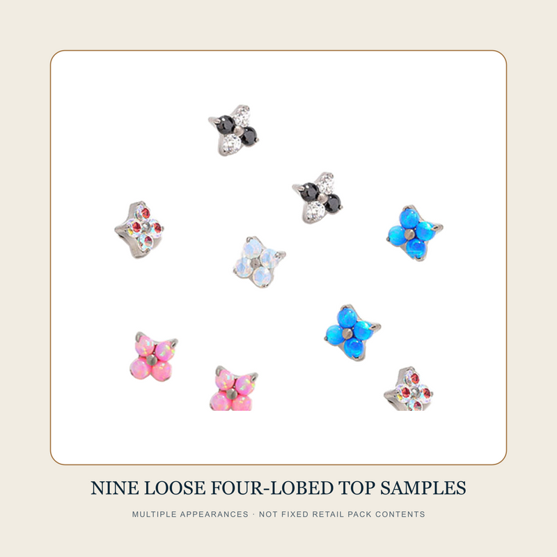Nine separate four-lobed accent top source samples in black, clear, red, iridescent, blue and pink appearances