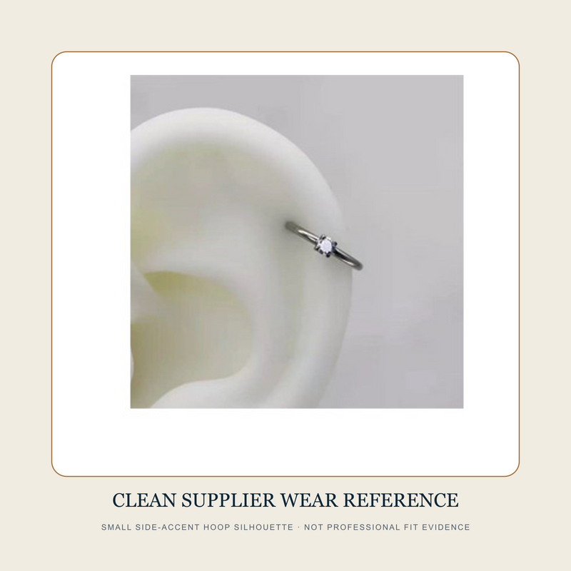 Small clean supplier wearing reference of a steel-tone circular hoop with one clear-looking side accent