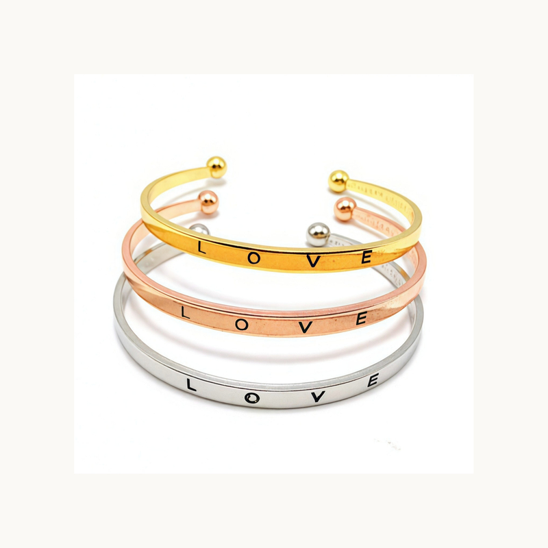 The Loveband fixed LOVE-letter cuff bracelet in Steel, Rose Gold, and Gold finishes