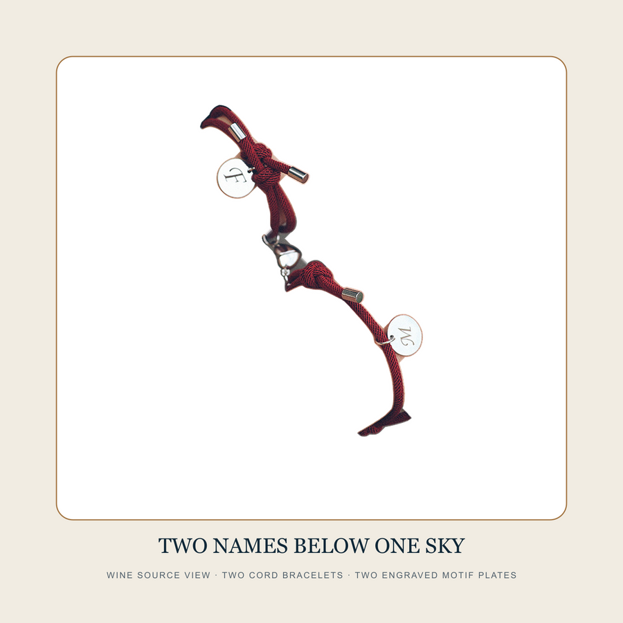 Wine source view of Two Names Below One Sky paired zodiac cord bracelets with two engraved round plates