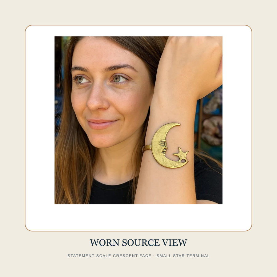 Worn source view of The Moon-Faced Morning gold-tone moon-and-star statement cuff on a wrist