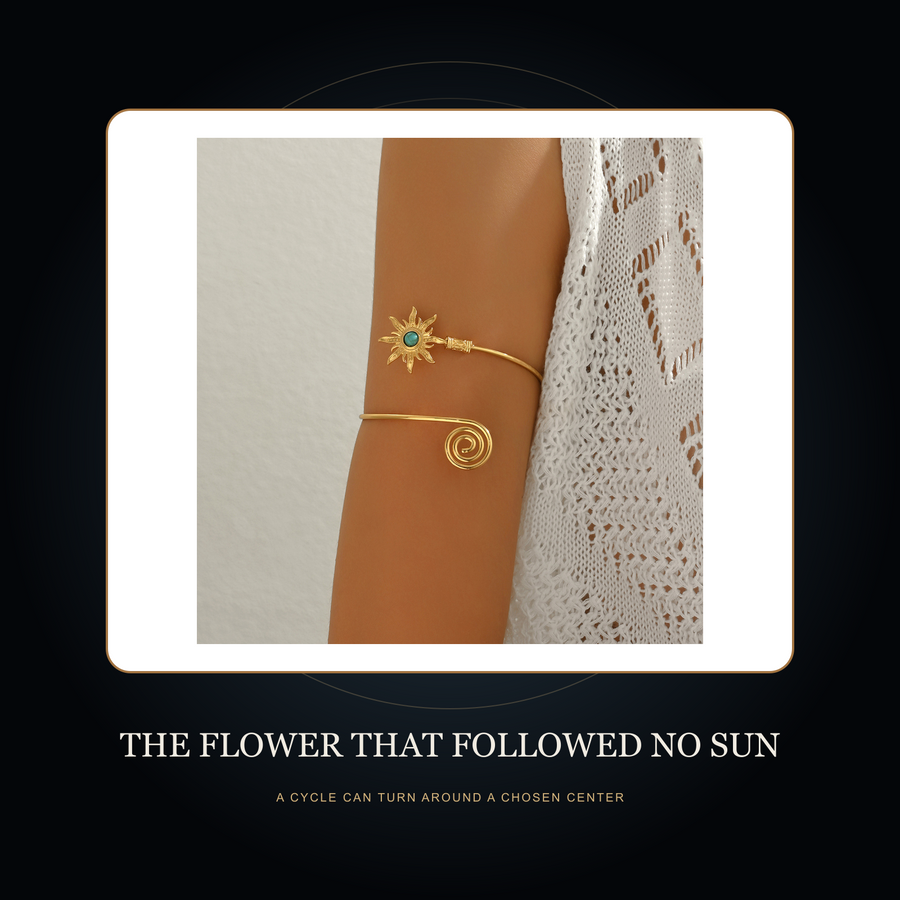The Turning Sun arm cuff in the fictional Flower That Followed No Sun Night Archive story scene