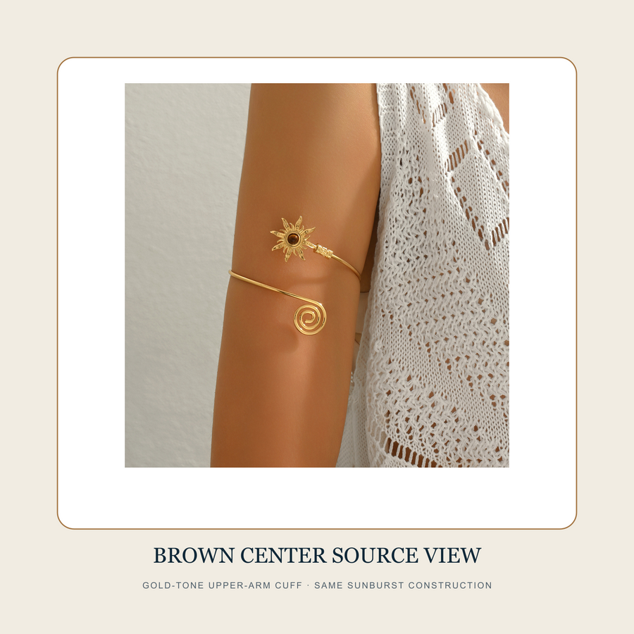 Worn source view of The Turning Sun gold-tone upper-arm cuff with brown center and spiral terminal