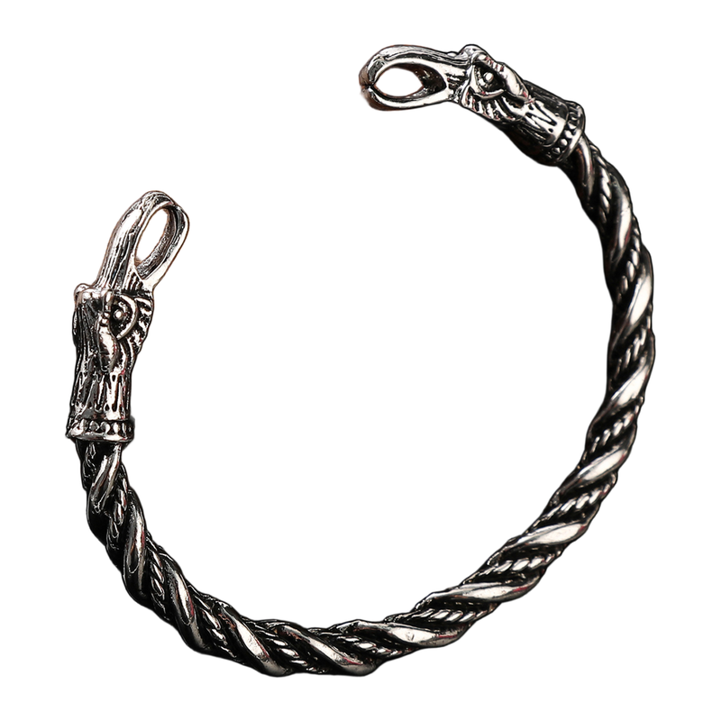 Open-circle view of The Ravenwatch silver-tone bird-head cuff
