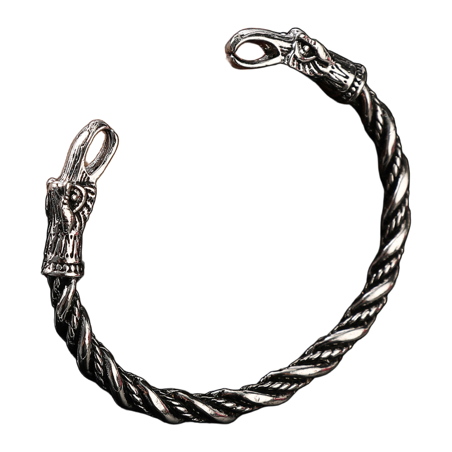 Open-circle view of The Ravenwatch silver-tone bird-head cuff