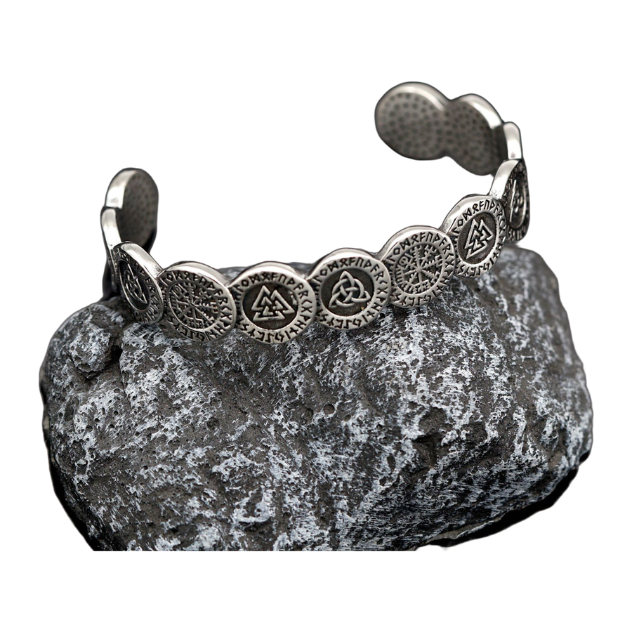 The Oathband antique silver-tone open cuff displayed on stone