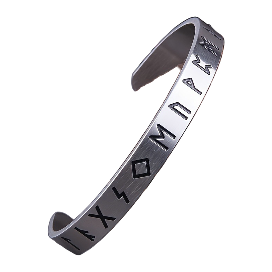 Angled view of The Runewrit dark recessed rune-style engraved marks