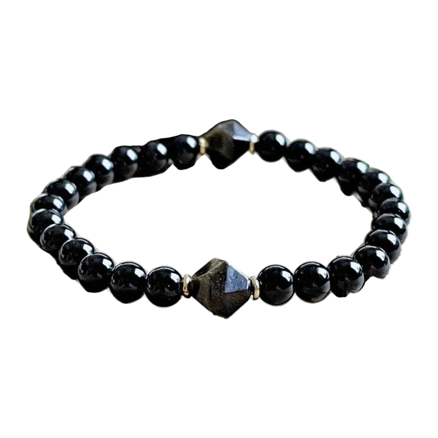 Angled view showing The Starfield stretch-style strand and faceted accent beads