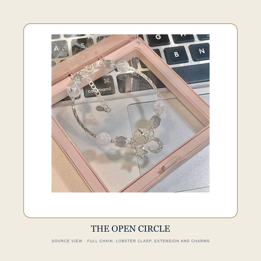 Full source view of The Broken Orbit chain bracelet clasp extension beads crescent and star charms