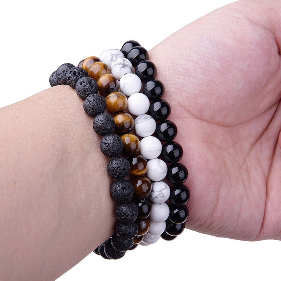 Close worn view comparing banded brown, glossy black, porous black, and non-sold white sample strands