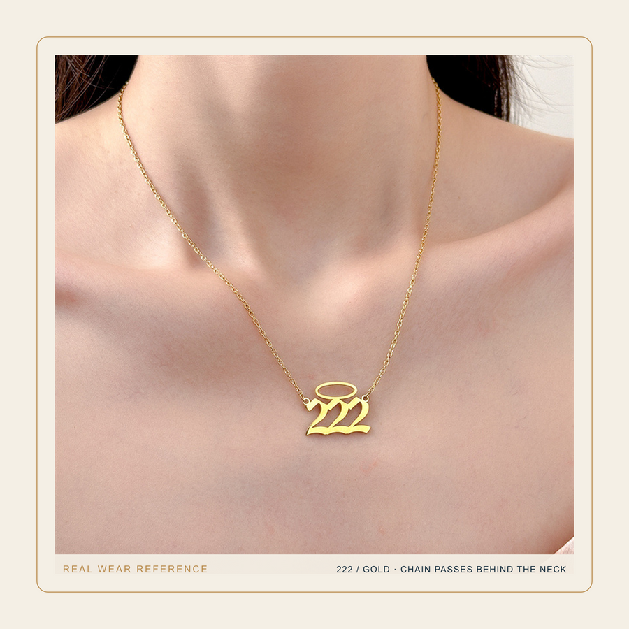Gold 222 Halo Number necklace in a real source wear photograph with the chain passing behind the neck