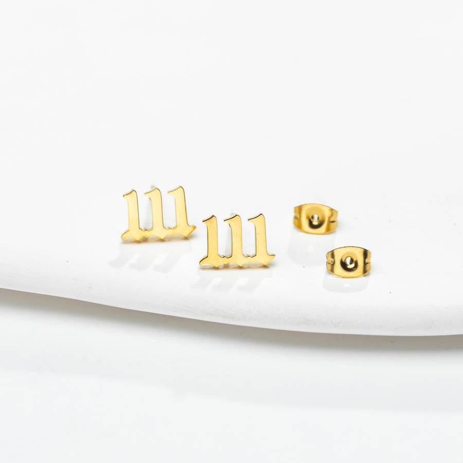 Gold-tone 111 Echo Number stud pair with butterfly-style backs