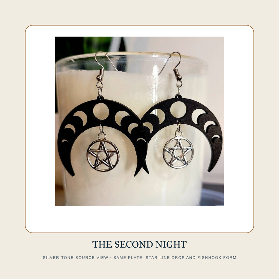 Silver-tone source view of The Two Unnamed Nights black moon-phase plate drop earring pair