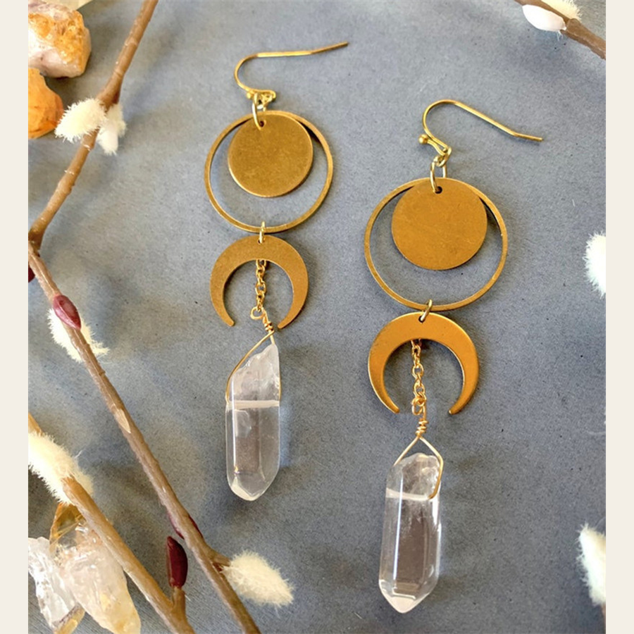 Detailed pair view of The Crystal Crescent round plates, crescents and clear point-style drops