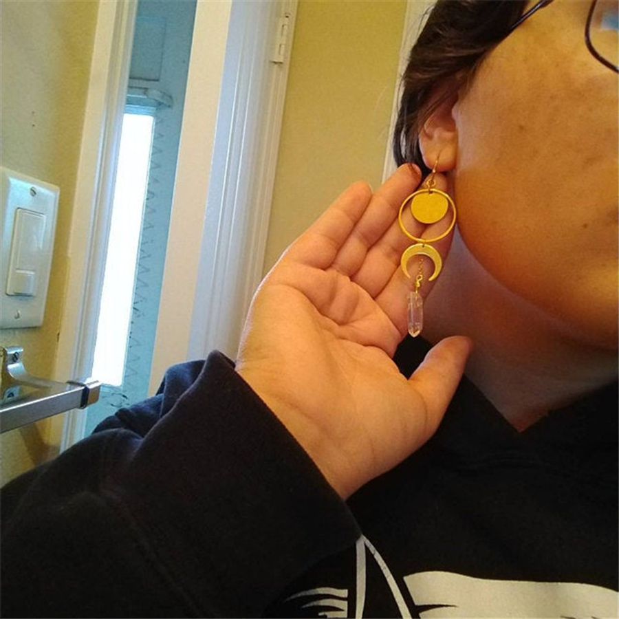 Worn scale reference for The Crystal Crescent long articulated earring