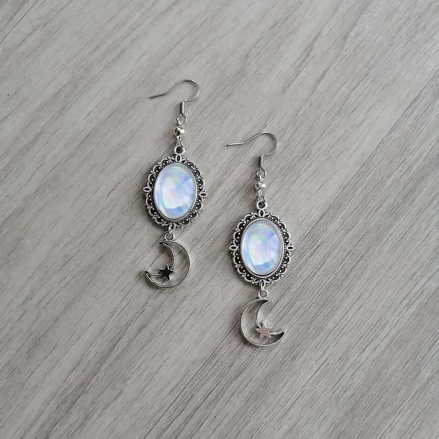 Pair view of The Rose Crescent rainbow-sheen oval frames and star crescent drops