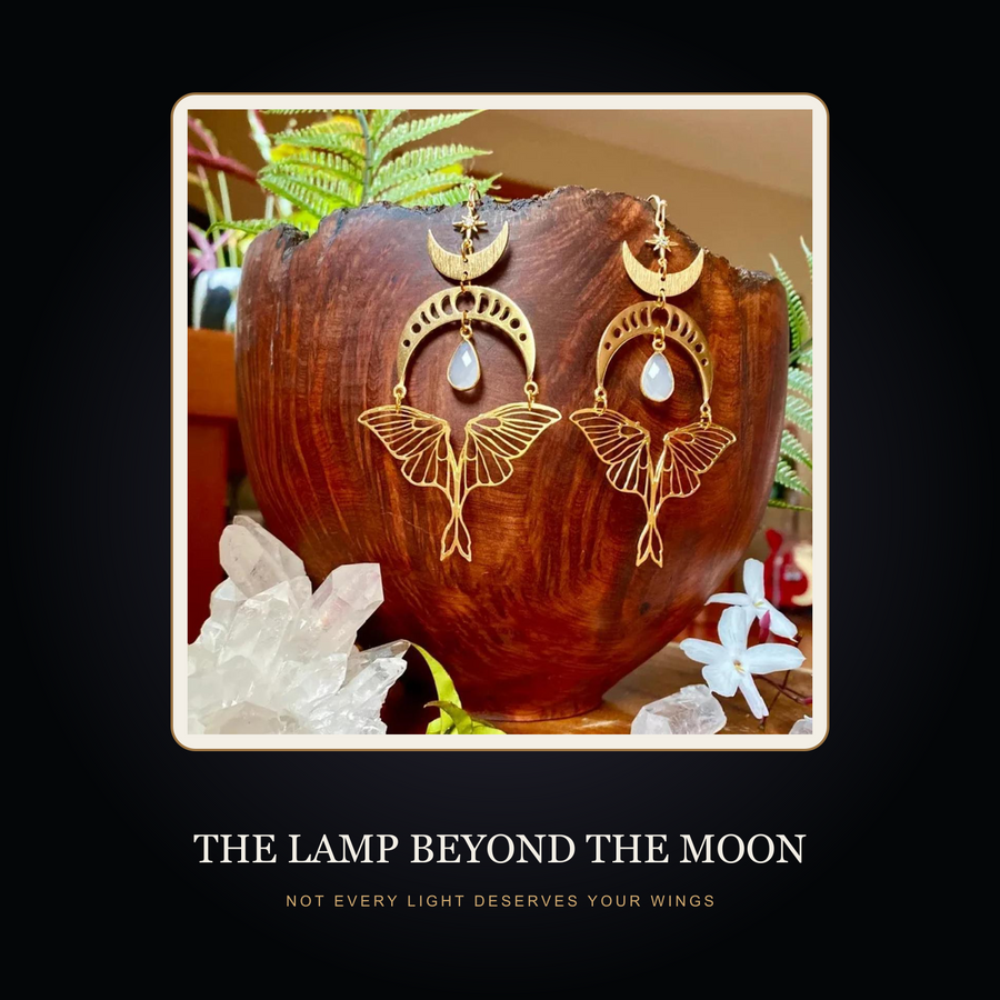 The Moonmoth earrings in the fictional Lamp Beyond the Moon story scene