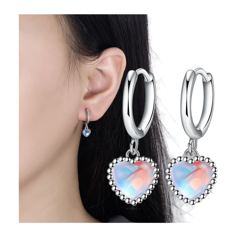 Worn scale view of The Moonheart silver-tone heart hoop earrings