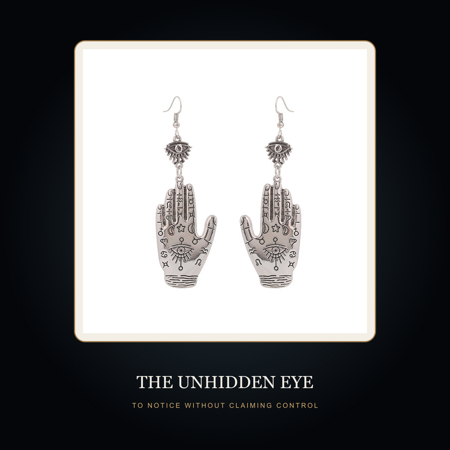 The Twin Wards earrings in the fictional Unhidden Eye story scene