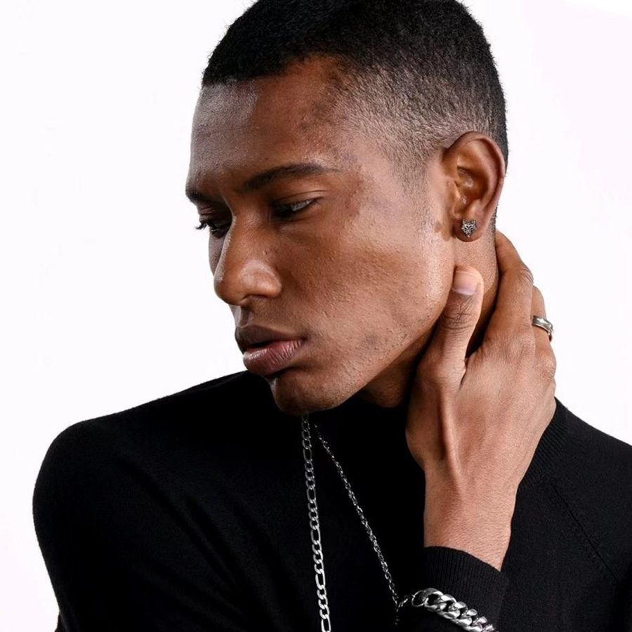 The Lone Wolf compact wolf-head-style stud earring shown at worn scale