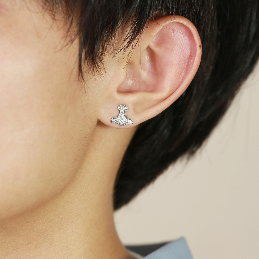 The Battle Axe steel-tone stud earring shown at true worn scale