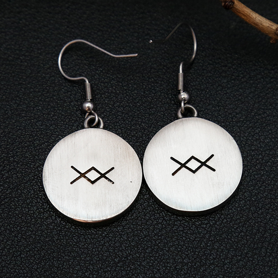Brushed reverse and crossed-diamond-style marks on The Northmark earrings
