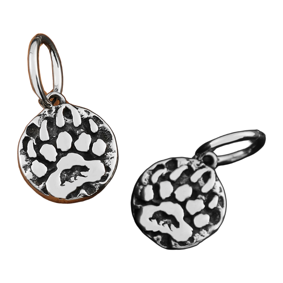 Angled view of The Clawmark hinged hoops and suspended round medallions