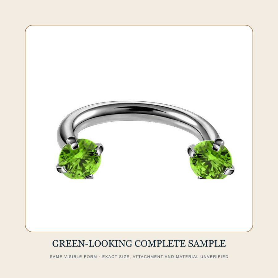 Complete steel-tone open curved-bar source sample with two green-looking multi-prong-held round ends