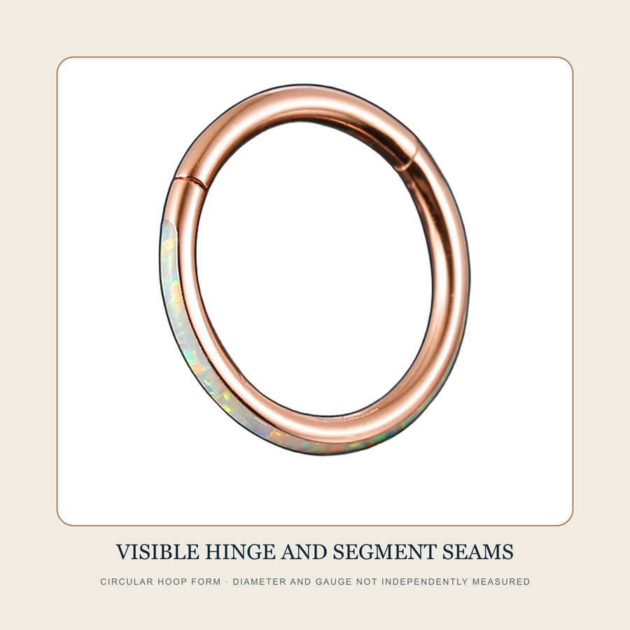 Rose-tone circular hoop with pale iridescent-looking side-set section and visible hinge seam