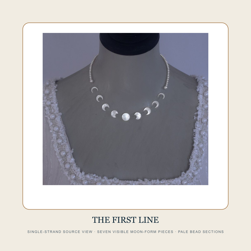 Single Moon Line source view of The Second Tide necklace with seven visible round and crescent forms