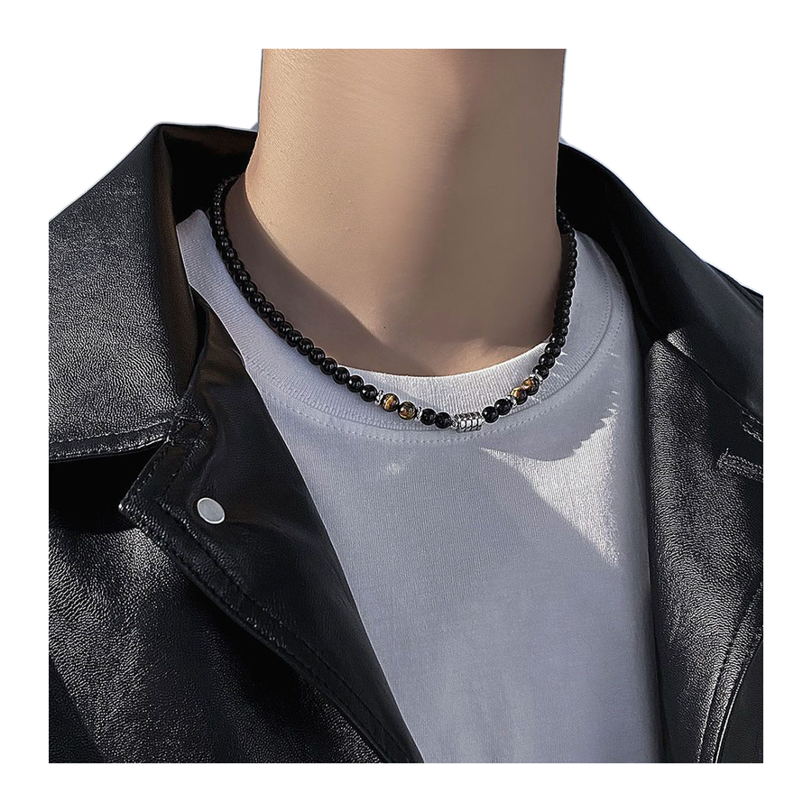 Supplier view of The Anchor Stone black and golden-brown bead necklace worn at the neck