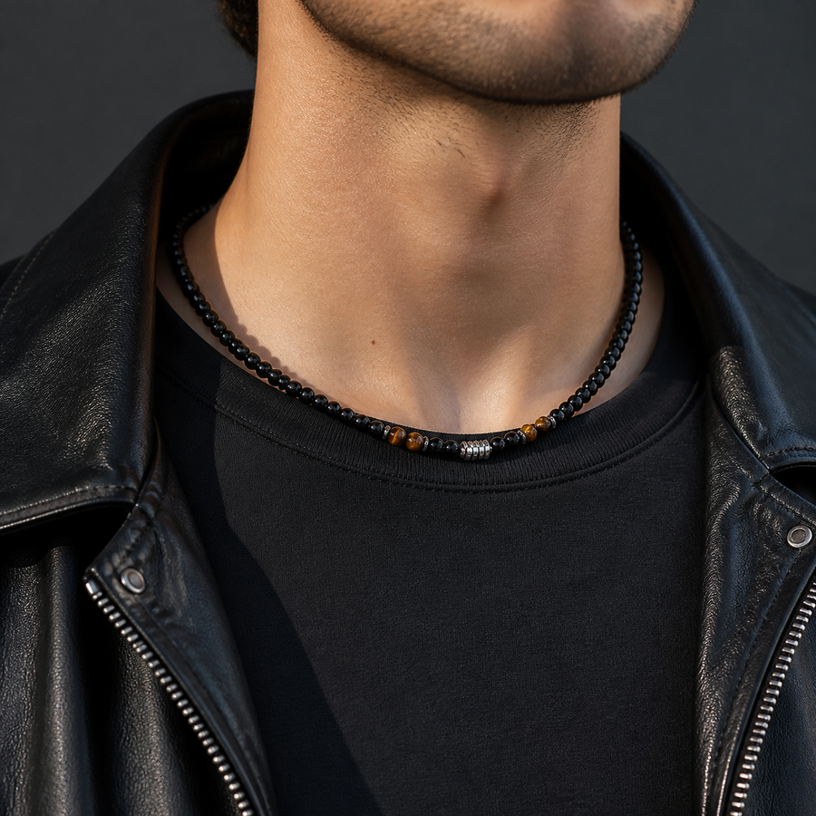 The Anchor Stone bead necklace worn with a black shirt and leather jacket