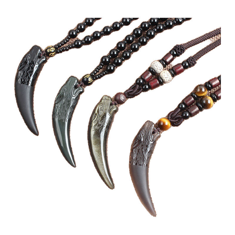 The Wolf Tooth carved fang necklace shown in its three verified cord and bead options