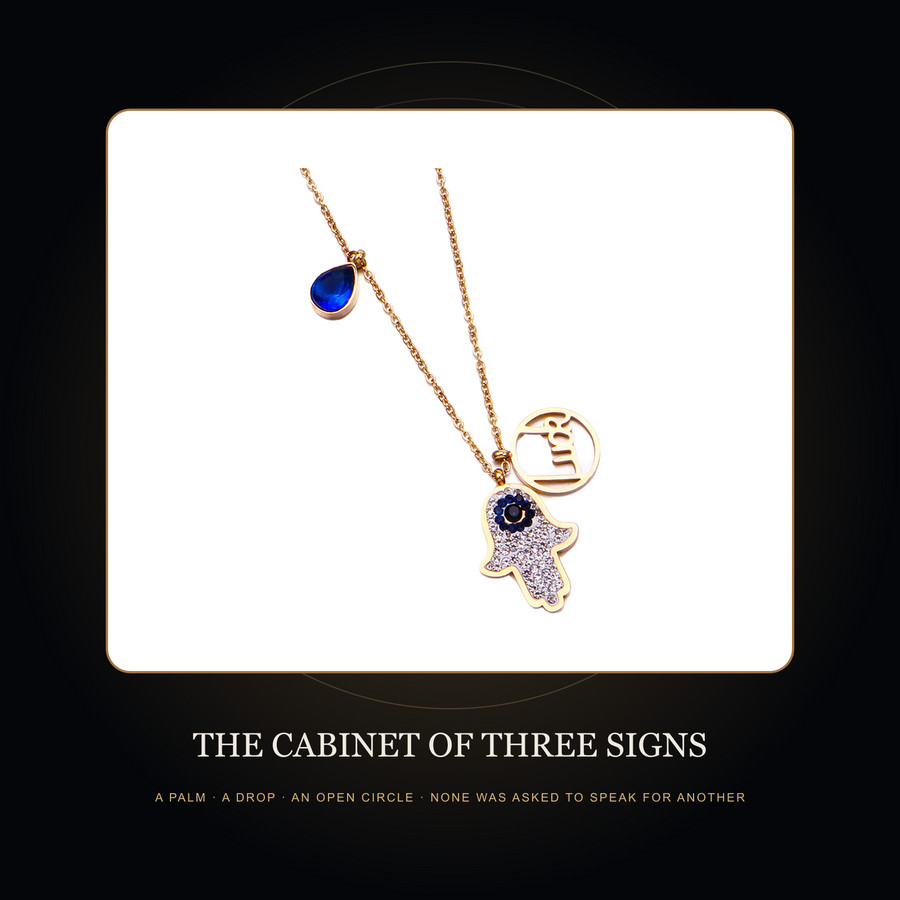The gold-tone multi-charm necklace in the fictional Cabinet of Three Signs story scene