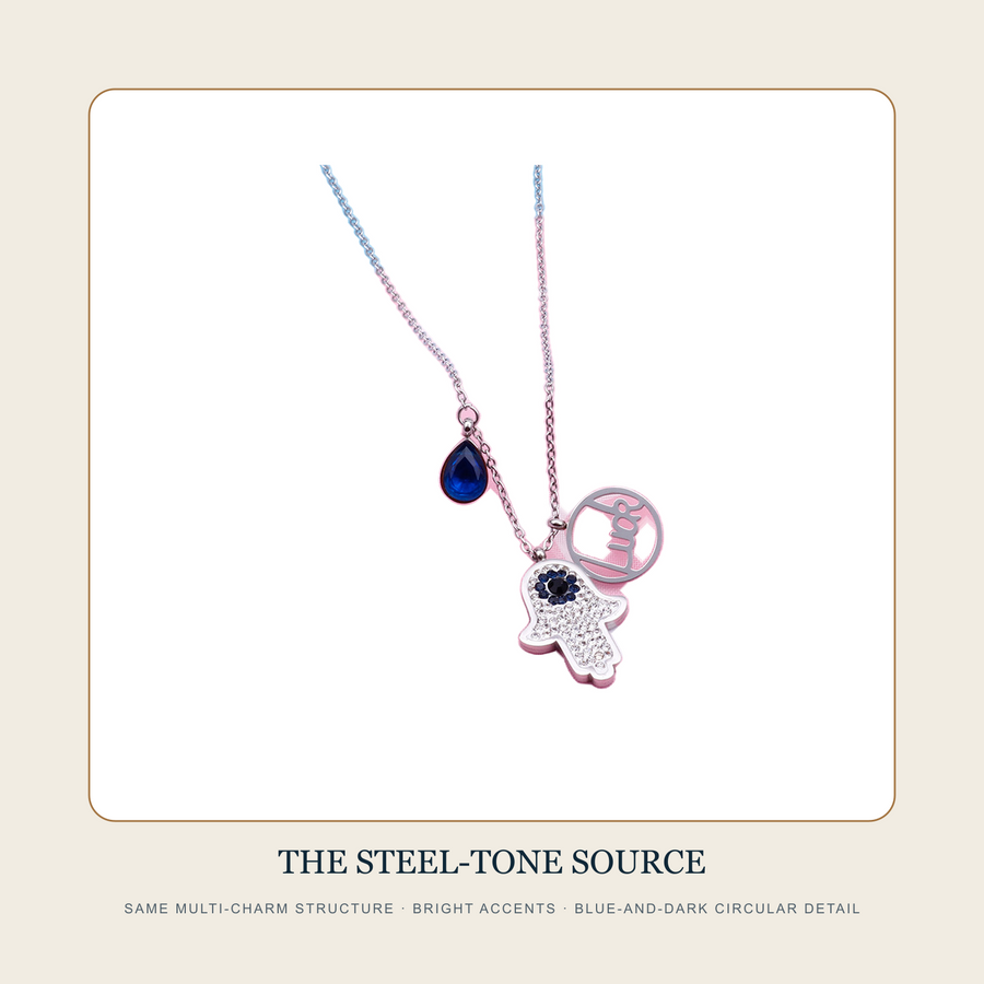 The Three Collected Signs steel-tone multi-charm necklace source view with the same three visible elements