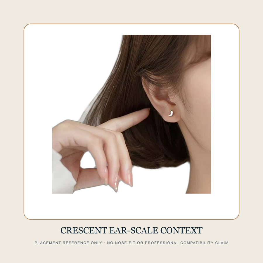 Crescent-form front shown at ear-lobe scale as placement context without a nose-fit claim