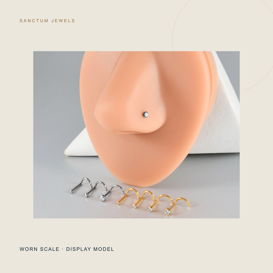 Display-model worn scale for The Sunspot clear-top nose stud