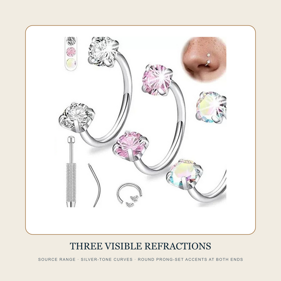 Source range detail of three silver-tone curved rings with round prong-set accents at both ends