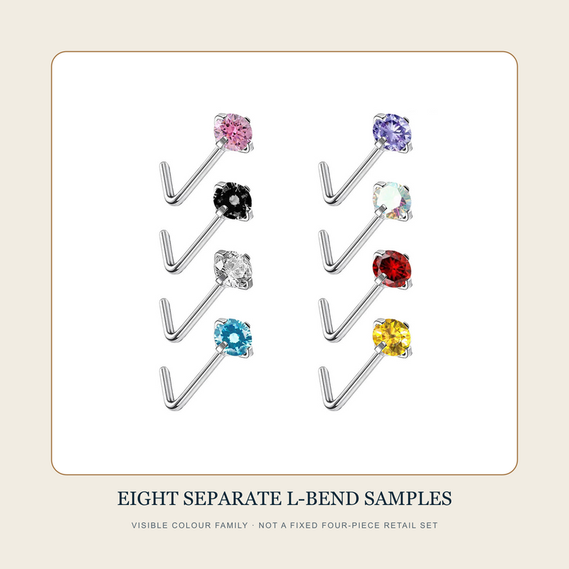Eight separate silver-tone L-bend stud source samples in pink, black, clear, blue, violet, iridescent, red and yellow appearances