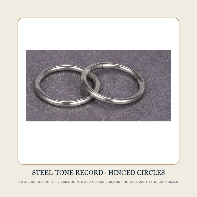 Two steel-tone plain circular hoops with visible joints and closure seams on a dark surface