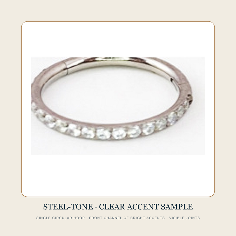 Steel-tone circular hoop source sample with a front channel of clear bright accents and visible joints