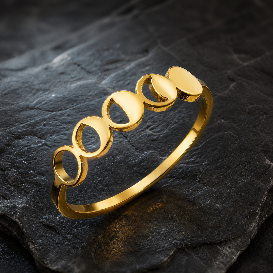 The First Crescent moon-phase band ring in Gold color on dark lunar stone