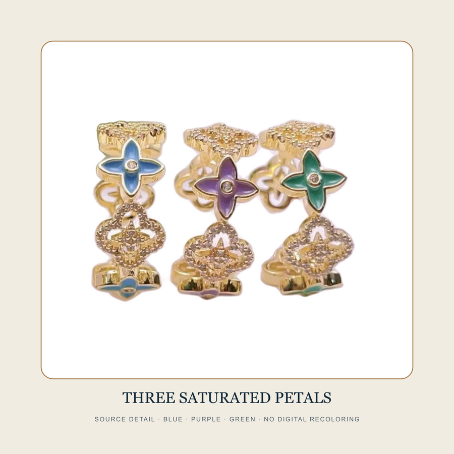 Source detail showing Blue, Purple and Green four-petal openwork wide rings without digital recoloring